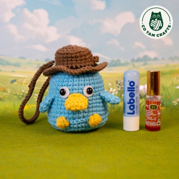 Goofy platypus lip balm holder amigurumi pattern by Co Tam Crafts