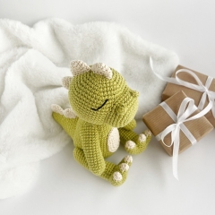 Dinosaur toy amigurumi pattern by AmiGuide