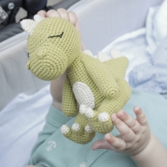 Dinosaur toy amigurumi pattern by AmiGuide