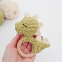 Dinosaur baby rattle amigurumi pattern by AmiGuide