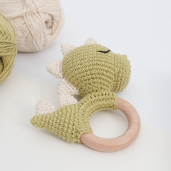 Dinosaur baby rattle amigurumi pattern by AmiGuide