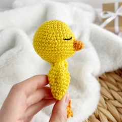 Duck baby rattle toy amigurumi pattern by AmiGuide
