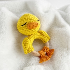 Duck baby rattle toy amigurumi pattern by AmiGuide