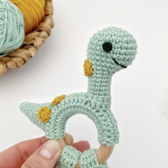 Dinosaur brontosaurus rattle toy amigurumi pattern by AmiGuide