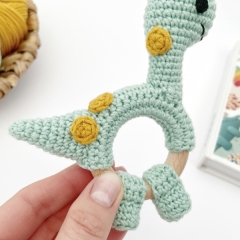 Dinosaur brontosaurus rattle toy amigurumi by AmiGuide