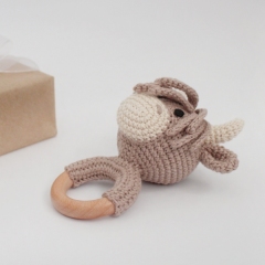 Highland cow baby rattle amigurumi pattern by AmiGuide