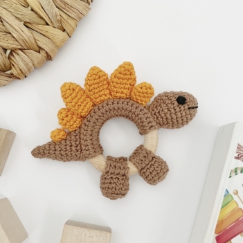 Dinosaur Stegosaurus rattle toy amigurumi pattern by AmiGuide