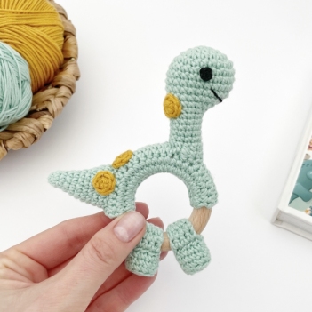 Dinosaur brontosaurus rattle toy amigurumi pattern by AmiGuide