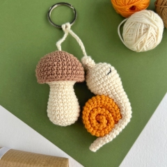 Snail and mushroom keychain  amigurumi by AmiGuide