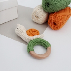 Snail baby rattle amigurumi pattern by AmiGuide