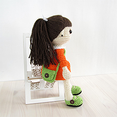 Girl in a dress with a messenger bag amigurumi pattern by Kristi Tullus