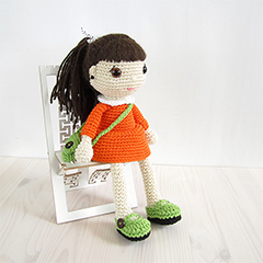 Girl in a dress with a messenger bag amigurumi pattern by Kristi Tullus